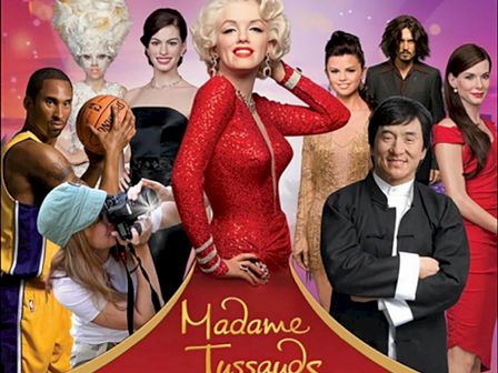 A poster shows wax figures at Madame Tussauds Hollywood, featuring various celebrities in different poses, and the Madame Tussauds logo at the bottom.